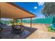 Outdoor patio area set up for entertainment with furniture at 405 Box Elder Way, Henderson, NV 89015