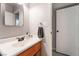 Simple and clean bathroom with wood vanity and neutral decor at 405 Box Elder Way, Henderson, NV 89015