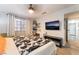 Bright bedroom featuring a work station, natural light, and a comfortable bed at 405 Box Elder Way, Henderson, NV 89015