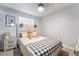 Serene bedroom featuring a decorative headboard and neutral decor at 405 Box Elder Way, Henderson, NV 89015
