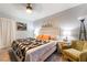 Inviting bedroom with a cozy chair, carpet flooring, and neutral decor at 405 Box Elder Way, Henderson, NV 89015