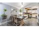Lovely dining area featuring a modern table setting and decorative plants near the updated kitchen at 405 Box Elder Way, Henderson, NV 89015