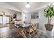 Charming dining room with stylish table and chairs, open to a spacious living area at 405 Box Elder Way, Henderson, NV 89015