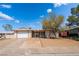 Charming single-story home featuring a xeriscaped front yard and attached two-car garage at 405 Box Elder Way, Henderson, NV 89015
