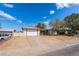 Quaint single-story home with desert landscaping, a covered patio, and a two-car garage at 405 Box Elder Way, Henderson, NV 89015