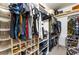 Organized walk-in closet with ample shelving, hanging space, and designated shoe racks at 405 Box Elder Way, Henderson, NV 89015