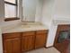 Stylish bar with cabinets, countertop, sink, and decorative tilework near a cozy fireplace at 5401 Painted Sunrise Dr, Las Vegas, NV 89149