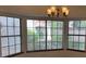 Bright dining area featuring a large bay window and chandelier at 5401 Painted Sunrise Dr, Las Vegas, NV 89149