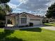 Charming single-story home with a well-maintained lawn and attached two-car garage at 5401 Painted Sunrise Dr, Las Vegas, NV 89149