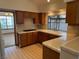 Functional kitchen featuring wooden cabinetry and tile countertops at 5401 Painted Sunrise Dr, Las Vegas, NV 89149