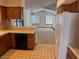 View of the kitchen, with ample cabinet space, leading into the open living area at 5401 Painted Sunrise Dr, Las Vegas, NV 89149