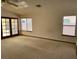 Bright living room with natural light, ceiling fan and a view of the backyard at 5401 Painted Sunrise Dr, Las Vegas, NV 89149