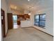 Open living space with a view of the kitchen and a large window providing ample natural light at 5401 Painted Sunrise Dr, Las Vegas, NV 89149