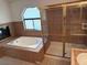 Main bath with shower stall, jetted tub and a unique window adding natural light at 5401 Painted Sunrise Dr, Las Vegas, NV 89149