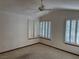 Light-filled main bedroom with plantation shutters and neutral carpet at 5401 Painted Sunrise Dr, Las Vegas, NV 89149