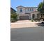 Charming two-story home with a tile roof, arched entry, and a two-car garage at 600 Our Heritage St, Henderson, NV 89011