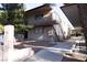 Two-story apartment building with stairs and balcony, offering a welcoming residential experience at 605 S Royal Crest Cir # 8, Las Vegas, NV 89169