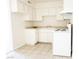 Classic kitchen design with white cabinets and neutral countertops at 605 S Royal Crest Cir # 8, Las Vegas, NV 89169