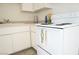 Neutral kitchen features white appliances and plenty of counter space at 605 S Royal Crest Cir # 8, Las Vegas, NV 89169