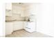 Bright kitchen with white cabinets and appliances, and neutral countertops at 605 S Royal Crest Cir # 8, Las Vegas, NV 89169