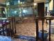 Elaborate bathroom with tiled floor, multiple mirrors, and step-up tub at 6325 Burgundy Way, Las Vegas, NV 89107