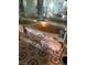 This bathroom has a large soaking tub, surrounded by patterned tile and a large mirror at 6325 Burgundy Way, Las Vegas, NV 89107