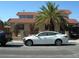 Charming two-story home with a red tile roof, desert landscaping, and secure gated yard at 6325 Burgundy Way, Las Vegas, NV 89107