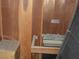 Sauna room with wooden walls, a traditional heater, and an authentic spa-like experience at 6325 Burgundy Way, Las Vegas, NV 89107