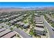 A high-angle aerial view of residential homes with well-manicured lawns at 689 Rogue Wave St, Las Vegas, NV 89138