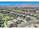 Aerial view of a neighborhood with manicured landscaping and community park at 689 Rogue Wave St, Las Vegas, NV 89138
