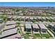Expansive aerial view of a densely populated neighborhood with well-maintained homes and mountain views at 689 Rogue Wave St, Las Vegas, NV 89138