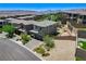 An aerial of a two-story home with low-maintenance landscaping and a paver driveway at 689 Rogue Wave St, Las Vegas, NV 89138