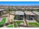 This aerial view showcases a two-story home with a cozy backyard setting in a vibrant neighborhood at 689 Rogue Wave St, Las Vegas, NV 89138