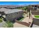 An aerial view shows a modern two-story home with low-maintenance landscaping and a cozy backyard at 689 Rogue Wave St, Las Vegas, NV 89138