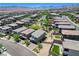 Aerial view of a modern home with a landscaped backyard at 689 Rogue Wave St, Las Vegas, NV 89138