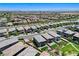 Aerial view of homes with synthetic turf, desert landscaping, and mountain views at 689 Rogue Wave St, Las Vegas, NV 89138