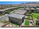 A panoramic aerial view features a two-story home with a cozy backyard in a residential neighborhood at 689 Rogue Wave St, Las Vegas, NV 89138