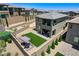 Gorgeous backyard with a manicured lawn, pergola, and outdoor seating at 689 Rogue Wave St, Las Vegas, NV 89138