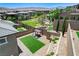 Backyard view with artificial turf, pergola, and desert landscaping at 689 Rogue Wave St, Las Vegas, NV 89138