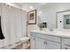 Clean and bright bathroom featuring a vanity with a sink and a shower with a curtain at 689 Rogue Wave St, Las Vegas, NV 89138