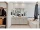Large bathroom with soaking tub, double sink vanity, a separate shower, and walk-in closet at 689 Rogue Wave St, Las Vegas, NV 89138