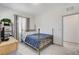 Comfortable bedroom featuring a bed, television, and natural light from a window at 689 Rogue Wave St, Las Vegas, NV 89138