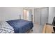 Bedroom featuring a wrought iron bed frame, and a pair of sliding doors at 689 Rogue Wave St, Las Vegas, NV 89138