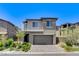 Charming two-story home with a well-manicured lawn and a two-car garage at 689 Rogue Wave St, Las Vegas, NV 89138