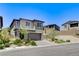 Stylish home featuring a two-car garage and a low-maintenance landscaped front yard at 689 Rogue Wave St, Las Vegas, NV 89138
