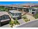 A charming two-story home boasts a desert landscaped front yard and mountain views at 689 Rogue Wave St, Las Vegas, NV 89138