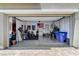 Open garage with epoxied floors, storage and shelving at 689 Rogue Wave St, Las Vegas, NV 89138