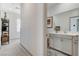 Hallway featuring contemporary design elements and leading to a serene bathroom at 689 Rogue Wave St, Las Vegas, NV 89138