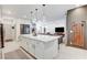 Open concept kitchen with a large island, lots of storage, and stainless steel appliances at 689 Rogue Wave St, Las Vegas, NV 89138
