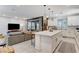 Open-concept kitchen and living area with a large island and ample seating at 689 Rogue Wave St, Las Vegas, NV 89138
